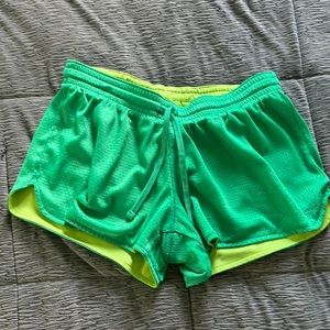 Green athletic shorts.